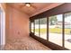 Relaxing screened patio with brick floors and views of the spacious backyard at 135 Eloise Oaks Dr, Winter Haven, FL 33884