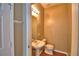 Neutral toned half bath with pedestal sink and standard toilet at 154 Canna Dr, Davenport, FL 33897