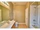 Neutral toned bathroom with a shower-tub combination and vanity at 154 Canna Dr, Davenport, FL 33897