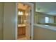 Bathroom features vanity and mirror in neutral toned room at 154 Canna Dr, Davenport, FL 33897