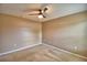 Simple carpeted bedroom with ceiling fan and neutral wall color at 154 Canna Dr, Davenport, FL 33897
