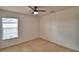 Bedroom with carpet, ceiling fan, and window providing natural light at 154 Canna Dr, Davenport, FL 33897