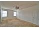 Bedroom featuring neutral carpeting, ceiling fan, and natural light at 154 Canna Dr, Davenport, FL 33897