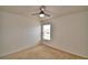 Bedroom featuring a ceiling fan, carpeted floor, and a window that invites natural light at 154 Canna Dr, Davenport, FL 33897