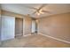 Carpeted bedroom features a closet and ensuite bathroom at 154 Canna Dr, Davenport, FL 33897