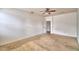 Bedroom featuring neutral carpeting and a ceiling fan at 154 Canna Dr, Davenport, FL 33897