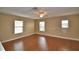 Large, open room with three windows providing plenty of natural light at 154 Canna Dr, Davenport, FL 33897