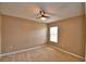 Bedroom featuring a ceiling fan, carpeted floor, and a window that invites natural light at 154 Canna Dr, Davenport, FL 33897