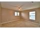 Bright bedroom with neutral walls and plush carpeting and great natural light at 154 Canna Dr, Davenport, FL 33897