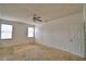 Bedroom featuring neutral carpeting, ceiling fan, and natural light at 154 Canna Dr, Davenport, FL 33897