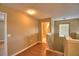 Upstairs hallway with wood floors, a view of a bathroom, and natural light at 154 Canna Dr, Davenport, FL 33897