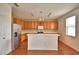 Spacious kitchen with wood cabinets, stainless steel appliances, and a center island at 154 Canna Dr, Davenport, FL 33897