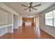 Open floor plan with laminate floors connecting the living room and kitchen at 154 Canna Dr, Davenport, FL 33897