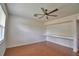 Inviting living room featuring laminate floors, a ceiling fan, and natural light at 154 Canna Dr, Davenport, FL 33897