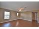 Bright living room with wood floors, neutral paint, and a ceiling fan at 154 Canna Dr, Davenport, FL 33897