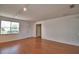 Inviting living room with laminate flooring, track lighting, and a white front door at 154 Canna Dr, Davenport, FL 33897