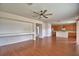 Spacious living room with laminate floors and an open view of the kitchen at 154 Canna Dr, Davenport, FL 33897