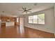 Bright, open living area with laminate floors and kitchen view, offering a welcoming space at 154 Canna Dr, Davenport, FL 33897
