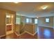 Loft area view into bathroom, natural light and laminate wood flooring at 154 Canna Dr, Davenport, FL 33897