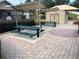 Outdoor picnic area with covered tables and a shed, ideal for gatherings and relaxation at 154 Canna Dr, Davenport, FL 33897