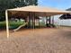 Community playground with a slide and climbing structures, perfect for Gathering fun at 154 Canna Dr, Davenport, FL 33897