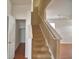 Staircase leading to the upper level with a closet space in the foyer at 154 Canna Dr, Davenport, FL 33897