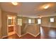 Open upstairs landing overlooking the home, featuring wood floors and a full bathroom at 154 Canna Dr, Davenport, FL 33897