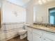 Bathroom featuring shower/tub, toilet, and vanity with granite counter and white cabinets at 157 Golf Aire Blvd, Haines City, FL 33844