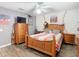 Bedroom with wood floors, dresser, and wall decorations at 157 Golf Aire Blvd, Haines City, FL 33844