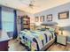 Bedroom featuring blue walls, hardwood floor and natural light at 157 Golf Aire Blvd, Haines City, FL 33844