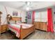 Bedroom with wood floors, dresser, and baseball theme at 157 Golf Aire Blvd, Haines City, FL 33844