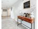 Inviting entryway featuring tile flooring and modern decor, setting a welcoming tone for the home at 157 Golf Aire Blvd, Haines City, FL 33844