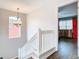 Hallway with view into a red bedroom at 157 Golf Aire Blvd, Haines City, FL 33844
