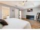 Main bedroom with tray ceiling, walk-in closet, ensuite bathroom, and wood-look floors at 157 Golf Aire Blvd, Haines City, FL 33844