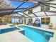 Enclosed pool area with a spa and lots of deck space for entertaining or relaxation at 157 Golf Aire Blvd, Haines City, FL 33844