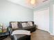 Comfortable sitting room with tile floors, pull-out couch, and neutral-toned walls at 157 Golf Aire Blvd, Haines City, FL 33844