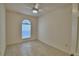 Neutral bedroom with light tile floors and ceiling fan at 1573 Vienna Square Dr, Winter Haven, FL 33884