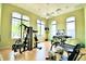 Well-equipped fitness center with modern exercise machines and bright natural light at 1573 Vienna Square Dr, Winter Haven, FL 33884