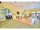 A great room or flex space with views to the exterior and a wood dance floor at 1573 Vienna Square Dr, Winter Haven, FL 33884