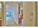Inviting hallway leads to a living area with large windows and natural light at 1573 Vienna Square Dr, Winter Haven, FL 33884