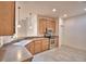 Bright kitchen featuring stainless appliances, pendant lighting, and tile flooring at 1573 Vienna Square Dr, Winter Haven, FL 33884