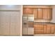 Bright kitchen with a stainless steel refrigerator and plenty of cabinet space at 1573 Vienna Square Dr, Winter Haven, FL 33884