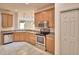 An open kitchen features stainless steel appliances and ample cabinet space at 1573 Vienna Square Dr, Winter Haven, FL 33884