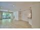 Bright, open living area with tiled floors, recessed lighting, and a view of the lanai at 1573 Vienna Square Dr, Winter Haven, FL 33884