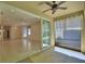 Living room with sliding glass doors to the screened lanai and tiled floors throughout at 1573 Vienna Square Dr, Winter Haven, FL 33884