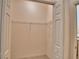 A walk-in closet with neutral walls and wire shelving for organized storage at 1573 Vienna Square Dr, Winter Haven, FL 33884