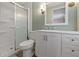 Bathroom featuring a shower, toilet, vanity with a sink and storage at 1610 Reynolds Rd # 242, Lakeland, FL 33801