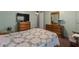 Bedroom featuring a bed, nightstand and two dressers at 1610 Reynolds Rd # 242, Lakeland, FL 33801