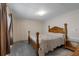 Bedroom featuring a bed, side table and a door at 1610 Reynolds Rd # 242, Lakeland, FL 33801