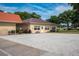 Community building featuring an exterior with a well manicured lawn at 1610 Reynolds Rd # 242, Lakeland, FL 33801